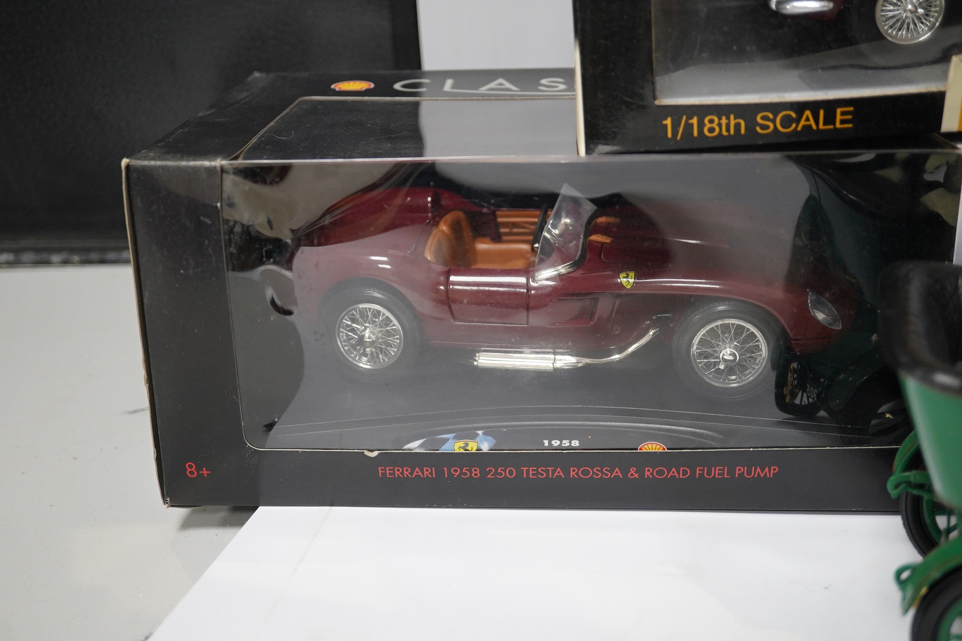 Five boxed large scale diecast cars; a 1:16 scale Franklin Mint 1905 Rolls-Royce 10hp, with one wheel detached and one side lamp detached (both present), together with four 1:18 scale cars; a Chrono Aston Martin DB5, a R